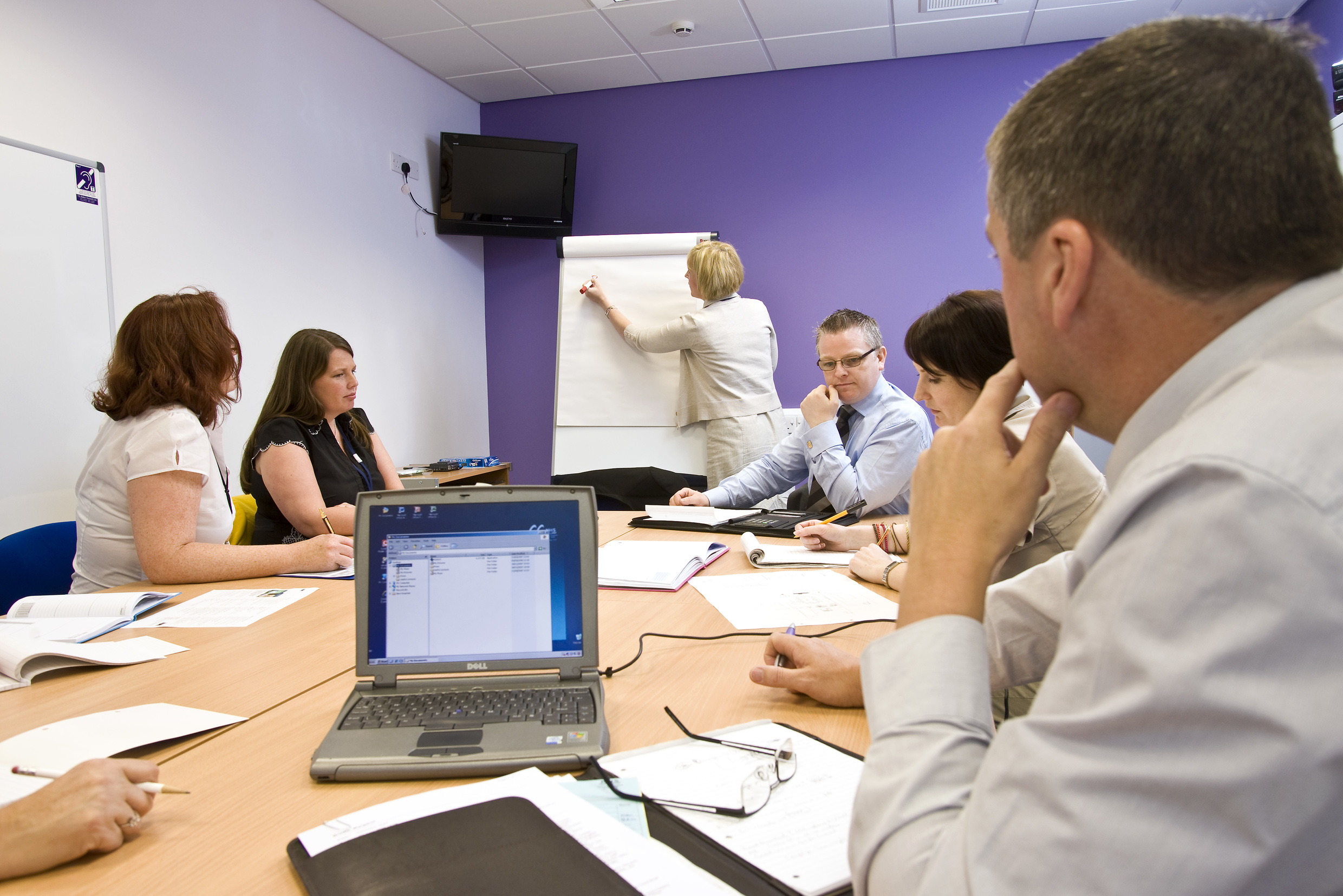 People sitting round table, learning, meeting